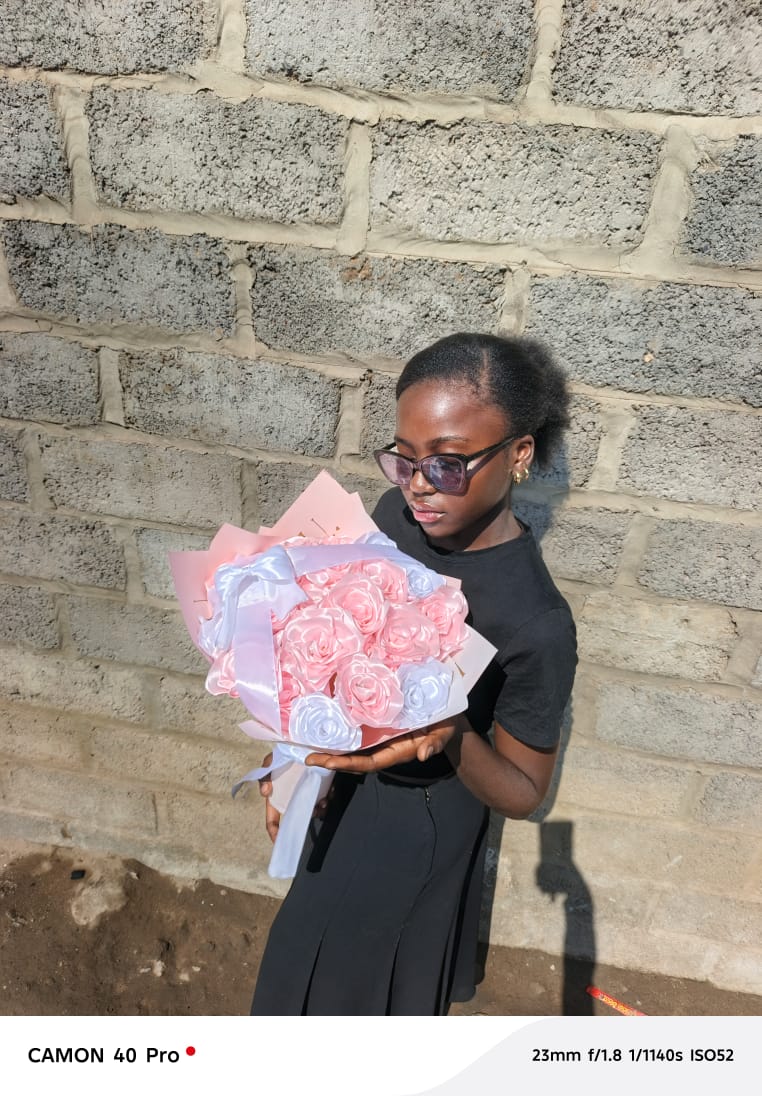 Ever Blooms founder holding a pink and white bouquet