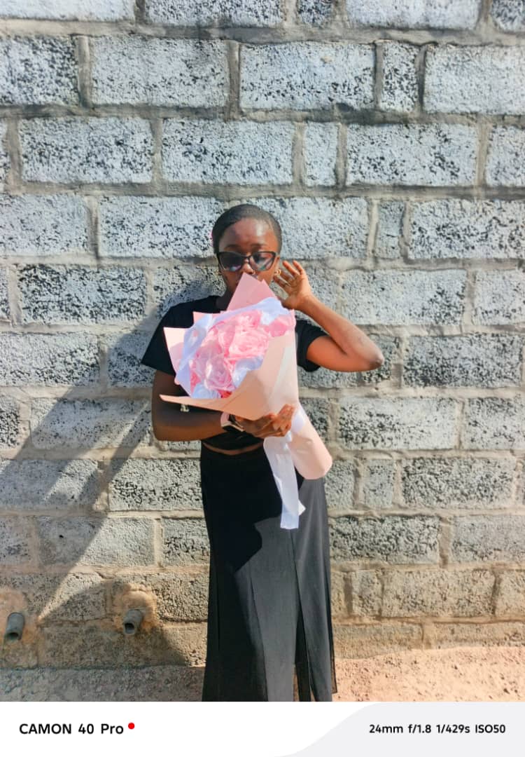 Ever Blooms founder with bouquet, playful pose