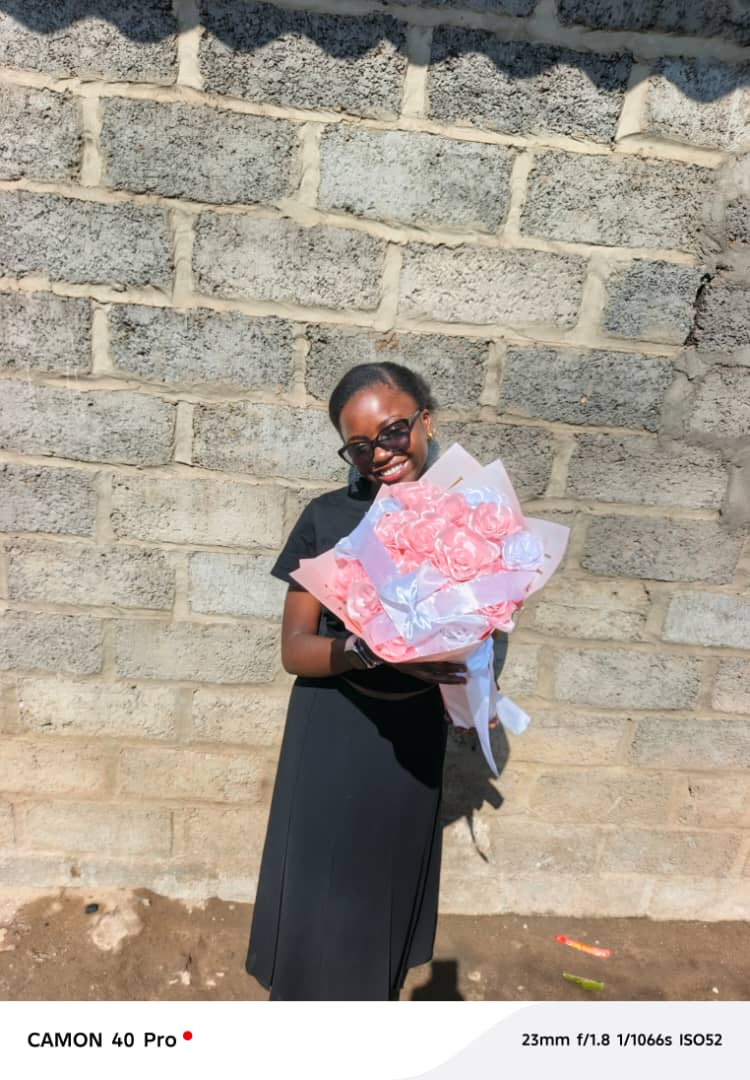 Woman holding a pink and white Ever Blooms bouquet